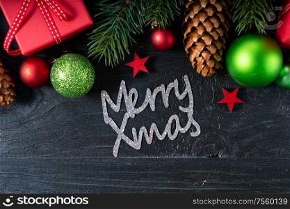 Christmas flat lay scene with red git boxes, Christmas celebration and gift giving concept, with merry xmas lettering. Christmas flat lay scene with golden decorations