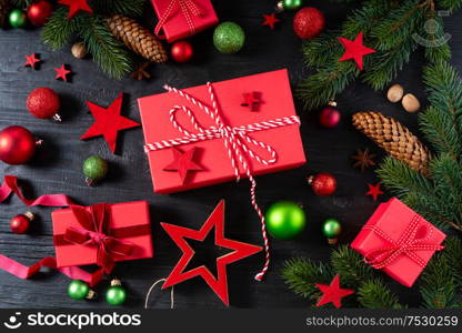 Christmas flat lay scene with red git boxes, Christmas celebration and gift giving concept. Christmas flat lay scene with golden decorations