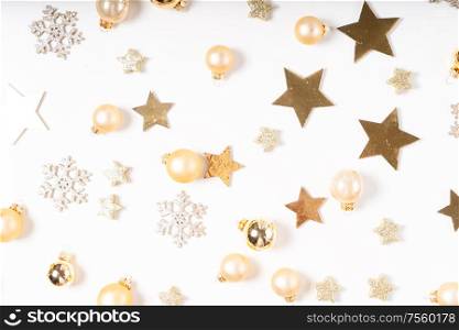 Christmas flat lay scene with scattered golden decorations, top view. Christmas flat lay scene with golden decorations