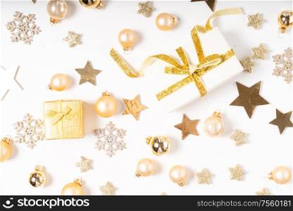 Christmas flat lay scene with two git box with golden bow knot on white desk. Christmas flat lay scene with golden decorations