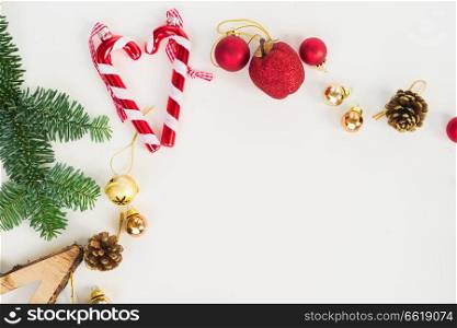 Christmas flat lay styled scene - top view scene with evergreen tree twigs and decorations. Christmas flat lay styled scene