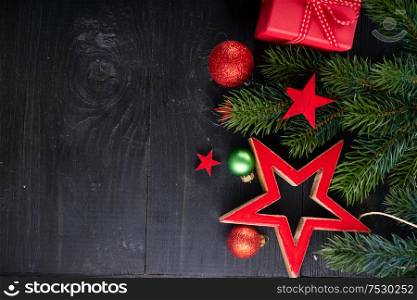 Christmas flat lay with red git boxes, Christmas celebration and gift giving concept border, copy space on wooden background. Christmas flat lay scene with golden decorations