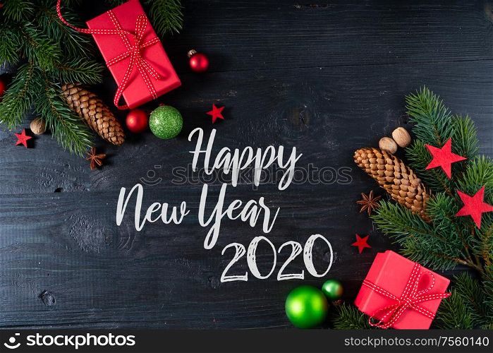 Christmas flat lay with red git boxes, Christmas celebration and gift giving concept, with happy new 2020 year greetings. Christmas flat lay scene with golden decorations