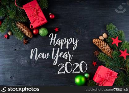 Christmas flat lay with red git boxes, Christmas celebration and gift giving concept, with happy new 2020 year greetings. Christmas flat lay scene with golden decorations
