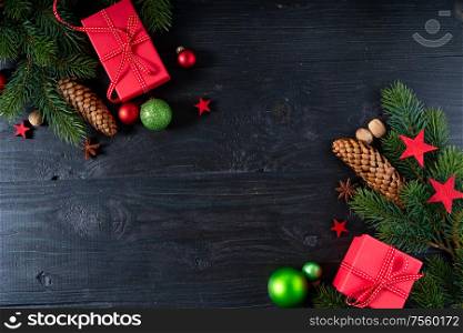 Christmas flat lay with red git boxes, Christmas celebration and gift giving concept, copy space on wooden background. Christmas flat lay scene with golden decorations