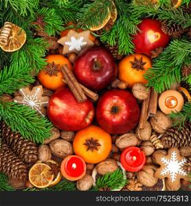 Christmas food backdround. Fruits, nuts, spices and cookies. Top view. Vibrant colors