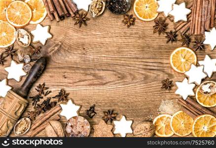 Christmas food background. Cookies and spices. Flat lay on wooden texture