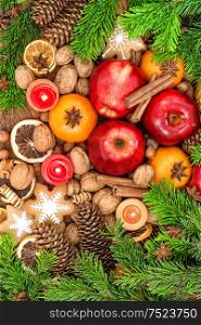 Christmas food background. Fruits, cookies, spices and nuts