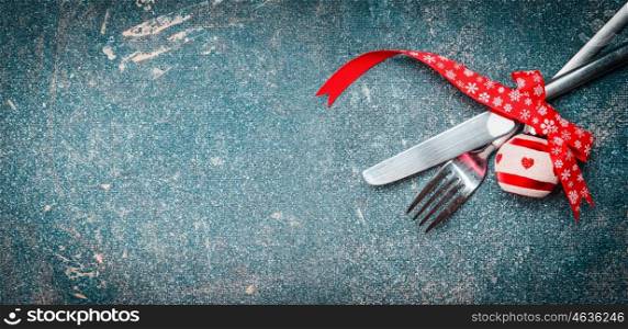 Christmas food background with table place setting: fork, knife and festive decoration, banner