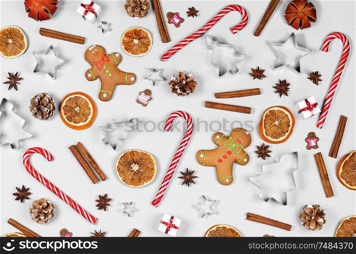Christmas food frame. Gingerbread cookies, spices and decorations on white background with copy space. Christmas food frame