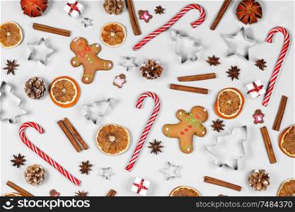Christmas food frame. Gingerbread cookies, spices and decorations on white background with copy space. Christmas food frame