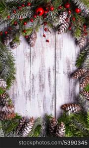 Christmas frame design with snow covered pinecones