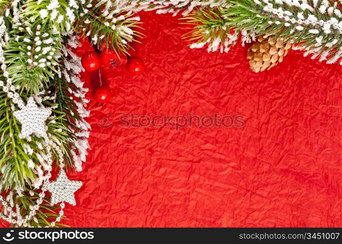 Christmas frame from branch and decorations on old paper background