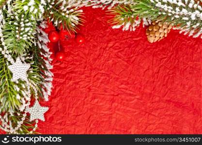Christmas frame from branch and decorations on old paper background