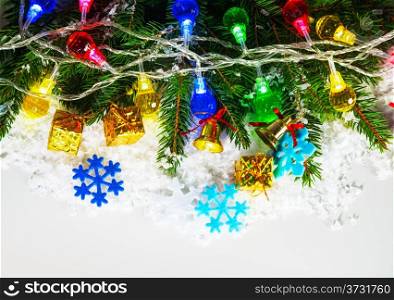 Christmas garland with evergreen branches over white background