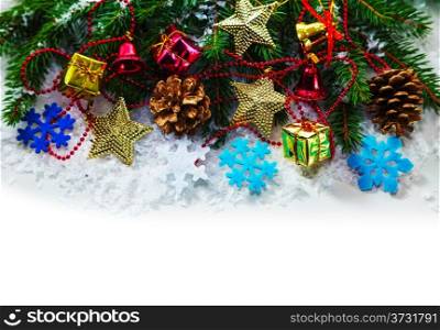Christmas garland with evergreen branches over white background