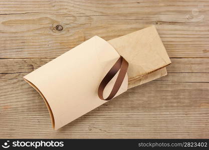 Christmas gift box on the old wooden background