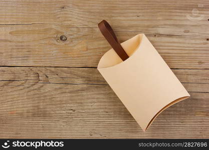 Christmas gift box on the old wooden background