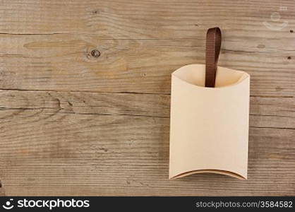 Christmas gift box on the old wooden background