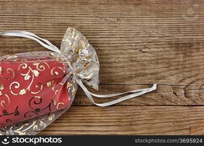 Christmas gift box on the old wooden background