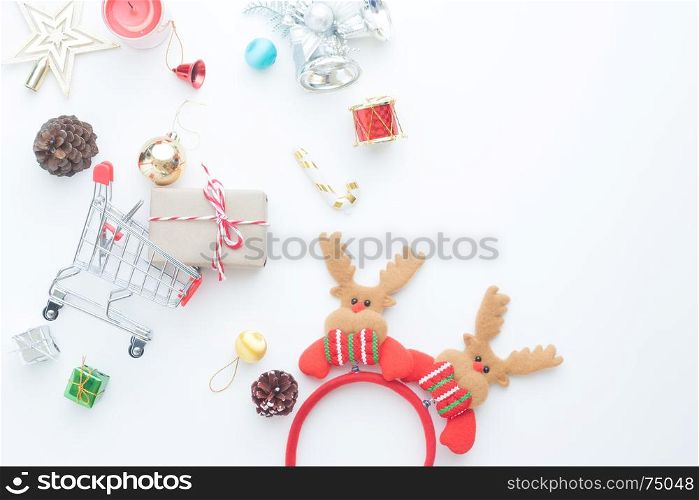 Christmas gift boxes, decorations and shopping cart on white background