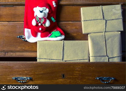 Christmas gift boxes in a drawer in a bureau