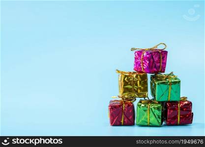 Christmas gift boxes on stylish blue background with copy space, retro modern design, Holiday,presents concept