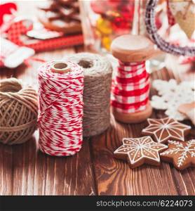 Christmas gift decorations - red and rustic ropes and gingerbread. Christmas gift decorations