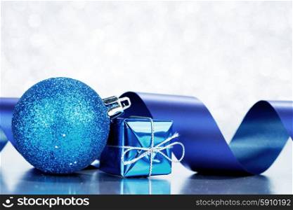 Christmas gifts and decorations on shiny glitter background