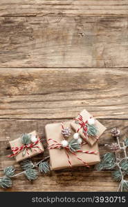 christmas gifts and decorations on wooden background