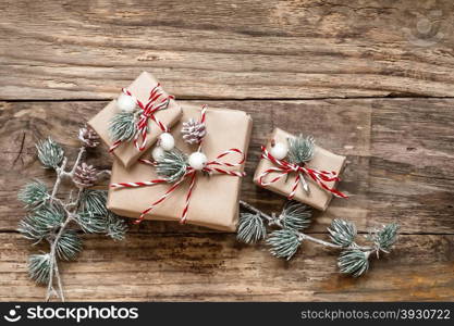 christmas gifts and decorations on wooden background