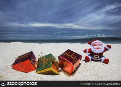 Christmas gifts on beach. Christmas gifts on the sand of tropical sea beach