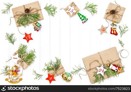 Christmas gifts, ornaments and decorations Advent calendar on bright wooden background