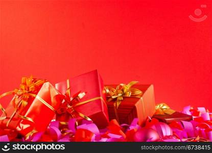 Christmas gifts over red background