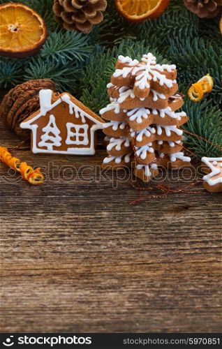 christmas gingerbread cookies. christmas gingerbread cookies with fir tree branches on wooden table