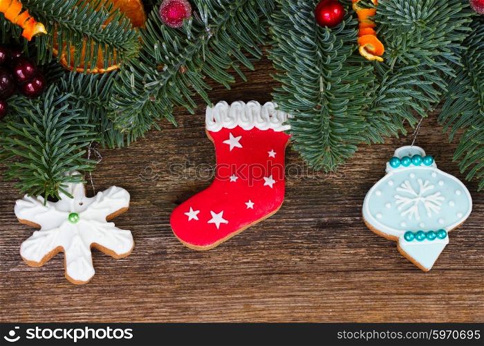 christmas gingerbread cookies. christmas gingerbread cookies with fir tree close up border on wood
