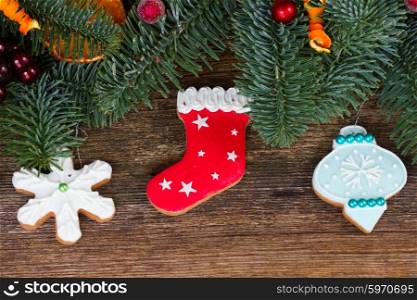 christmas gingerbread cookies. christmas gingerbread cookies with fir tree close up border on wood