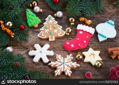 christmas gingerbread cookies. christmas gingerbread cookies with fir tree on wood