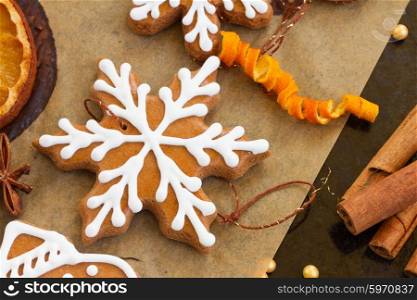 christmas gingerbread cookies. cooking and decorating christmas gingerbread cookies and orange slices close up