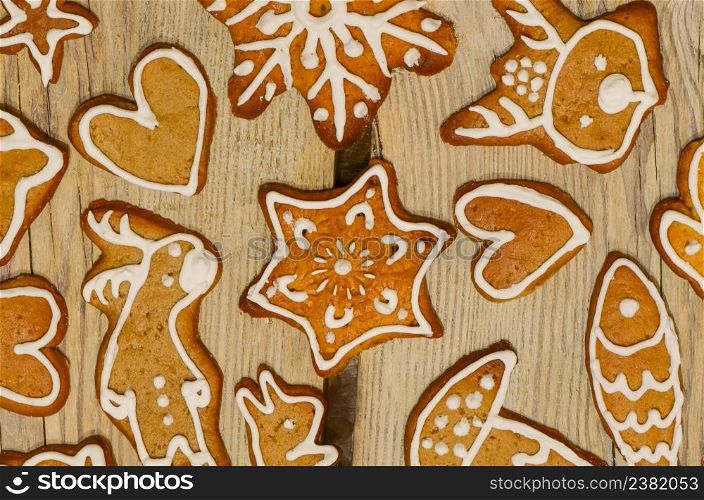 Christmas gingerbread cookies decorated icing. Christmas gingerbread cookies on wooden table top view.. Homemade Christmas gingerbread. Sweet Christmas homemade gift