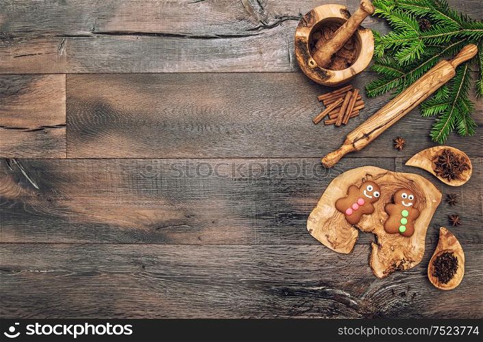 Christmas gingerbread cookies, spices and baking tools. Vintage style toned picture