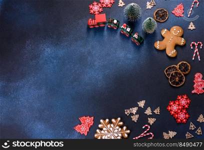 Christmas gingerbread. Delicious gingerbread cookies with honey, ginger and cinnamon. Christmas homemade gingerbread cookies on a dark concrete table
