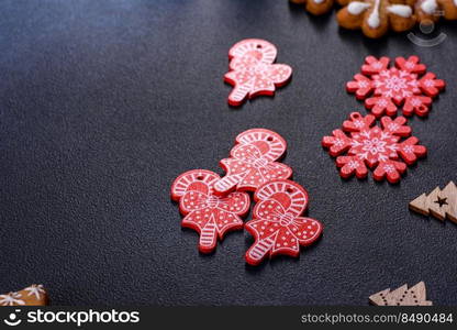 Christmas gingerbread. Delicious gingerbread cookies with honey, ginger and cinnamon. Christmas homemade gingerbread cookies on a dark concrete table