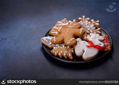 Christmas gingerbread. Delicious gingerbread cookies with honey, ginger and cinnamon. Winter composition. Delicious gingerbread cookies with honey, ginger and cinnamon