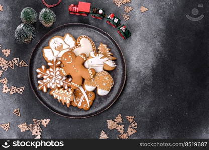 Christmas gingerbread. Delicious gingerbread cookies with honey, ginger and cinnamon. Winter composition. Delicious gingerbread cookies with honey, ginger and cinnamon