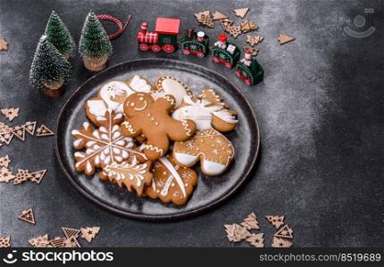 Christmas gingerbread. Delicious gingerbread cookies with honey, ginger and cinnamon. Winter composition. Delicious gingerbread cookies with honey, ginger and cinnamon