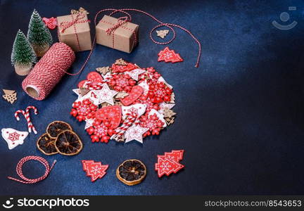 Christmas gingerbread. Delicious gingerbread cookies with honey, ginger and cinnamon. Winter composition. Christmas homemade gingerbread cookies on dark concrete table