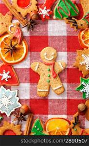 Christmas gingerbread man cookie over tablecloth
