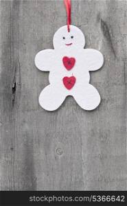 Christmas gingerbread man ornament on rustic style grunge background