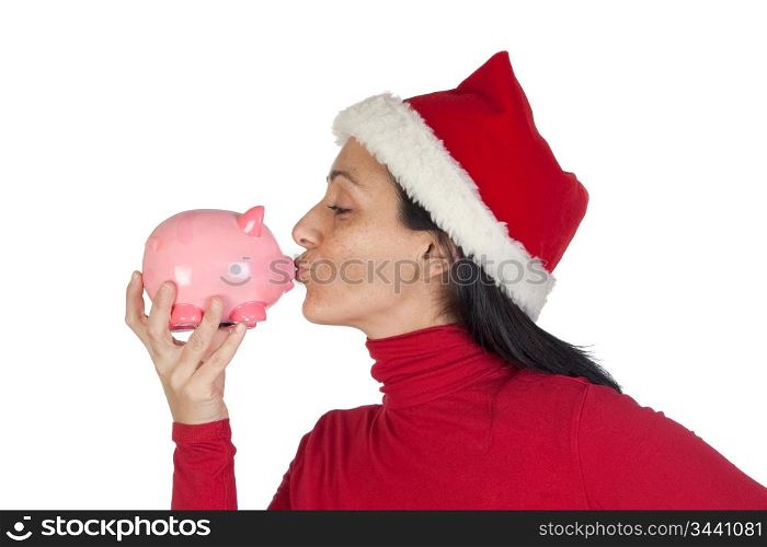 Christmas Girl giving a kiss piggy-bank isolated over white